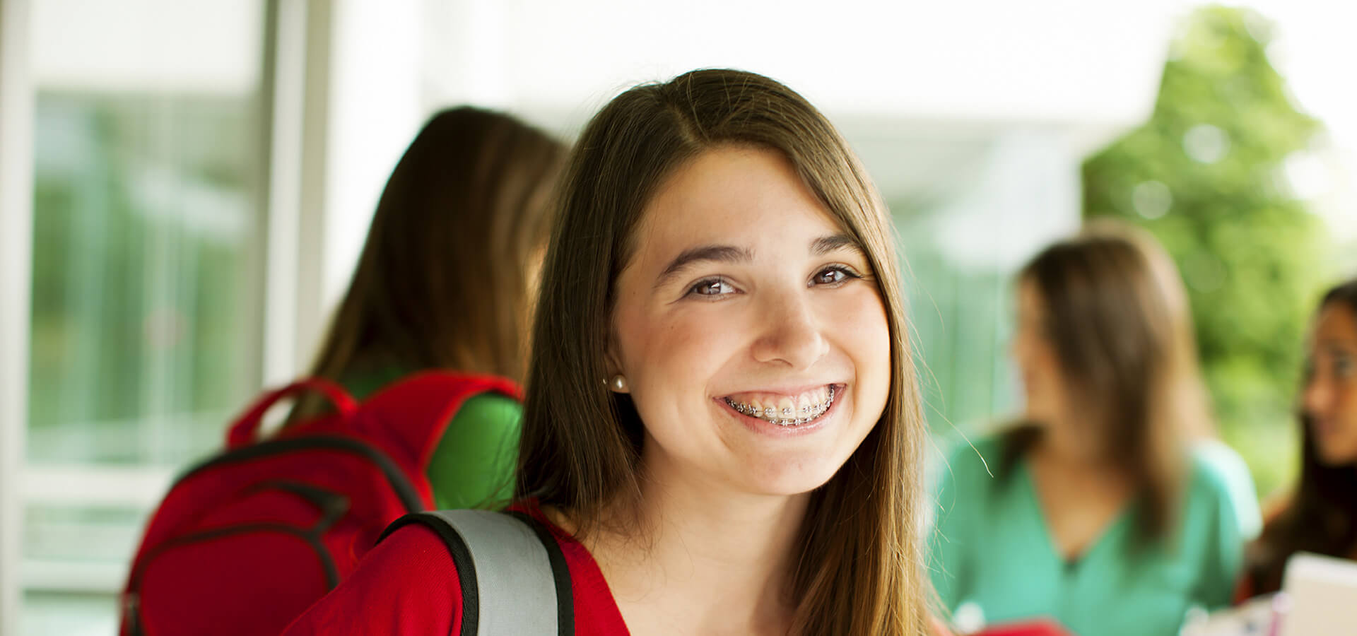 Smiling Brunette Teenage Girl in Braces